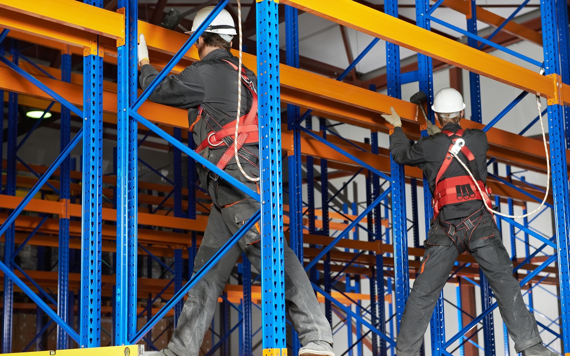 Crew installing pallet racking inside a warehouse