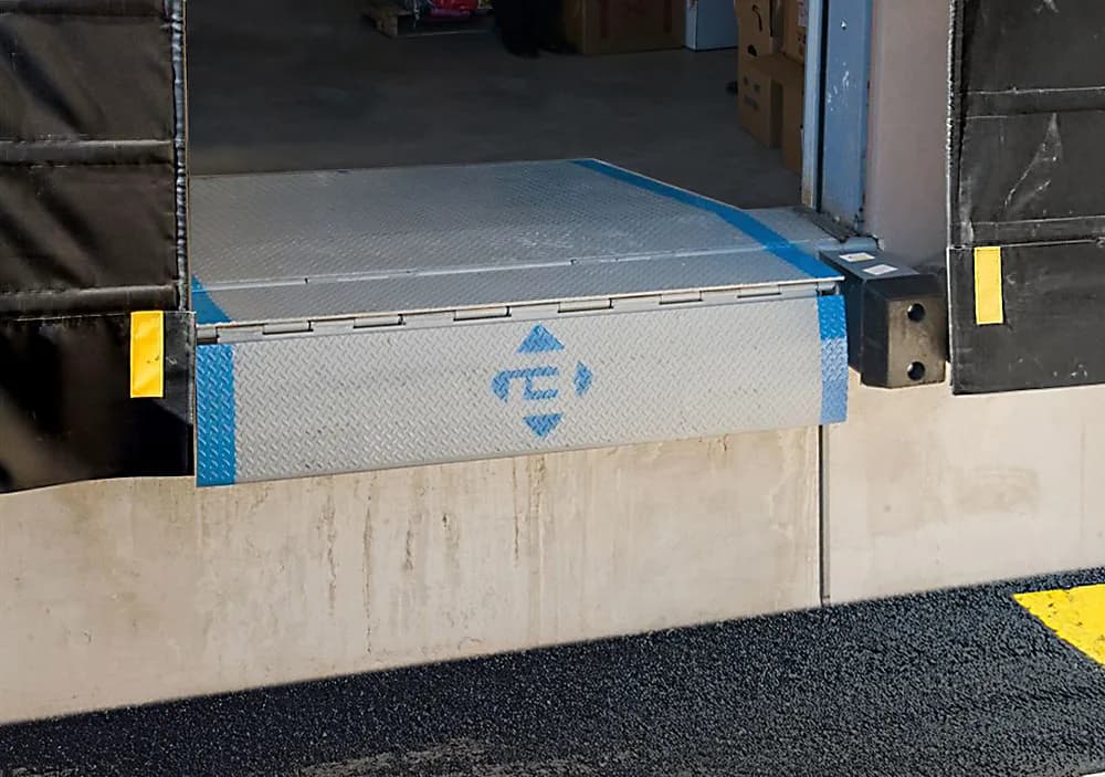 Warehouse loading dock leveler and door equipment installation