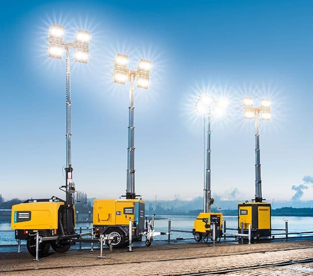 Towable portable light tower at a commercial construction site