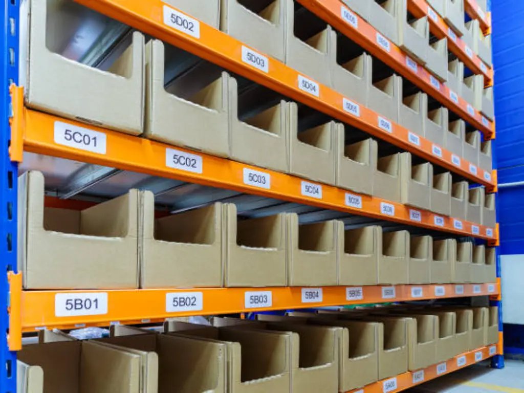 Barcode location labels along a warehouse shelf edge