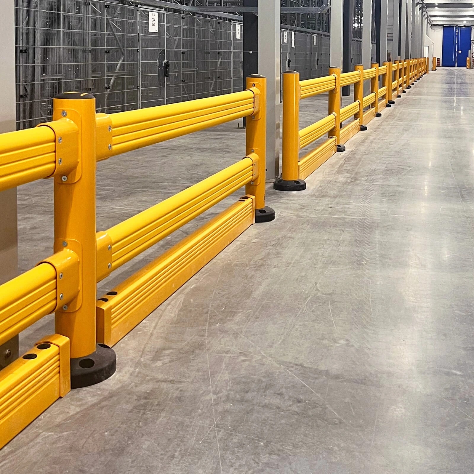 Polymer guardrail running along a warehouse route