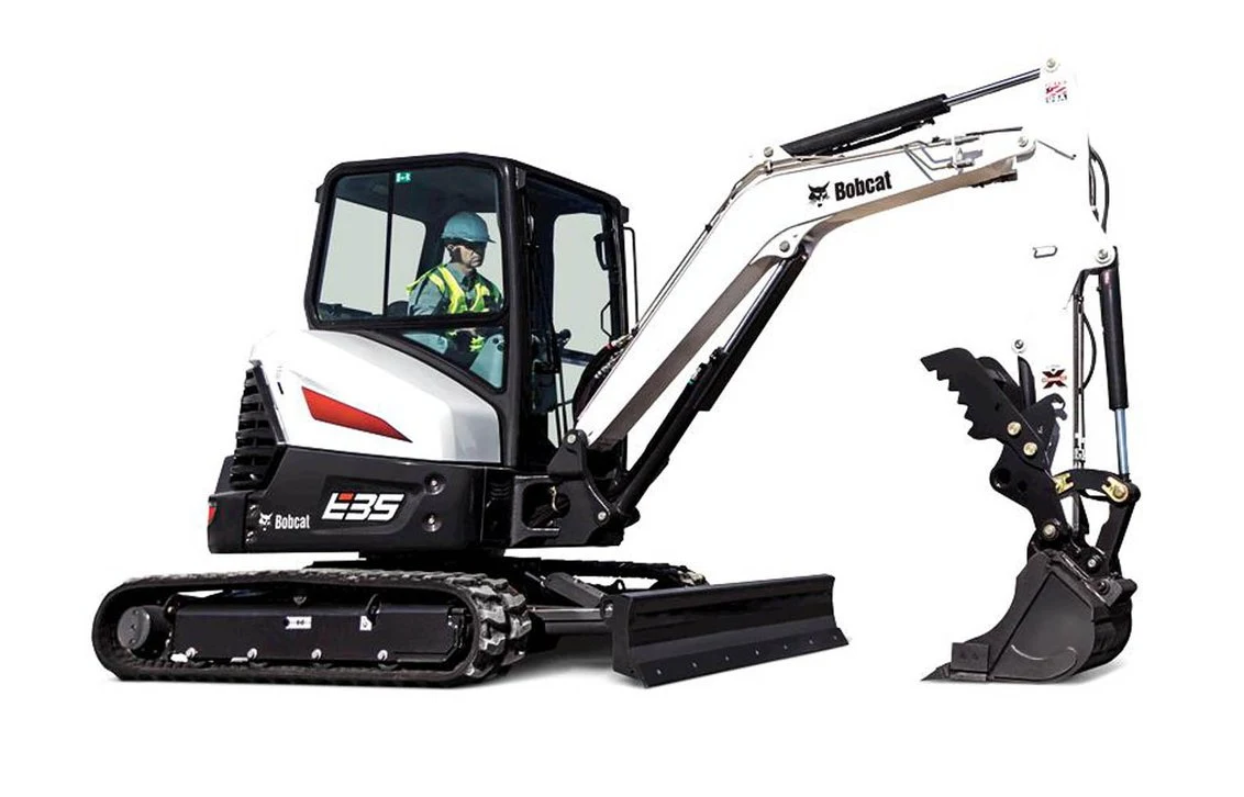 Compact tracked excavator with enclosed cab