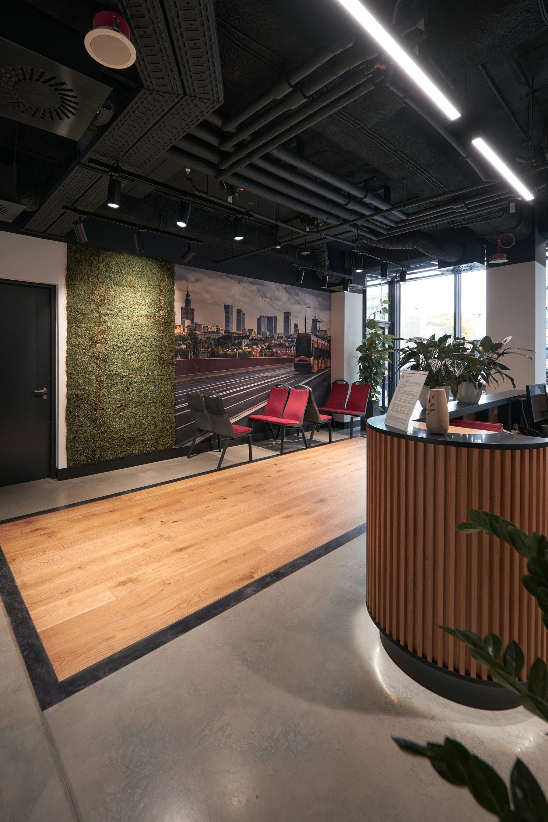 Large-format city mural installed across a commercial reception wall
