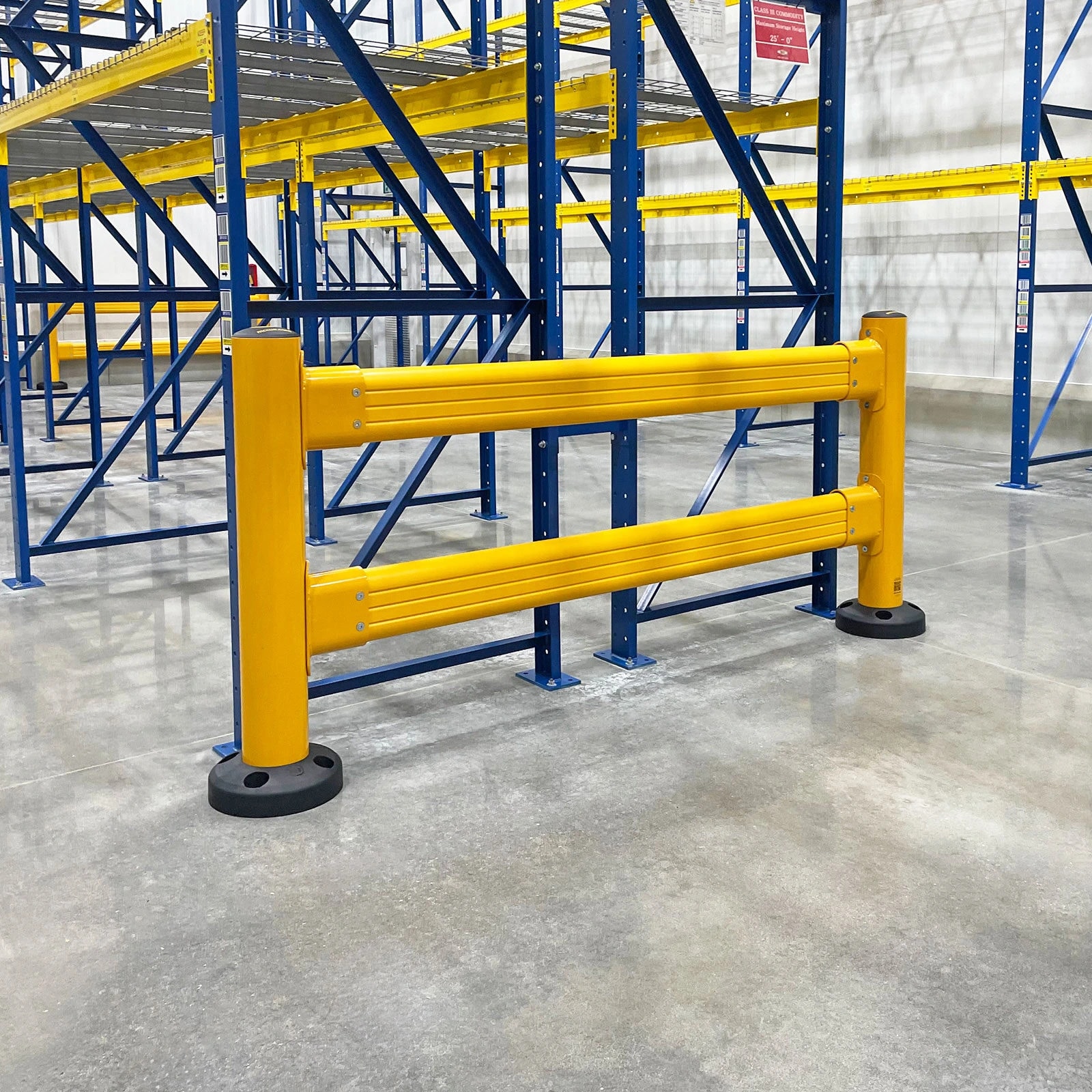 Double-rail barrier across the end of a pallet rack