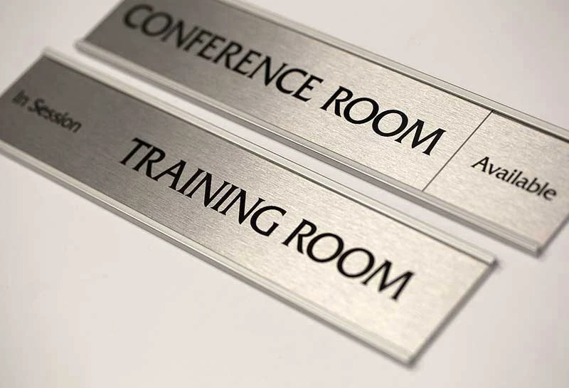 Commercial meeting-room nameplates with changeable inserts