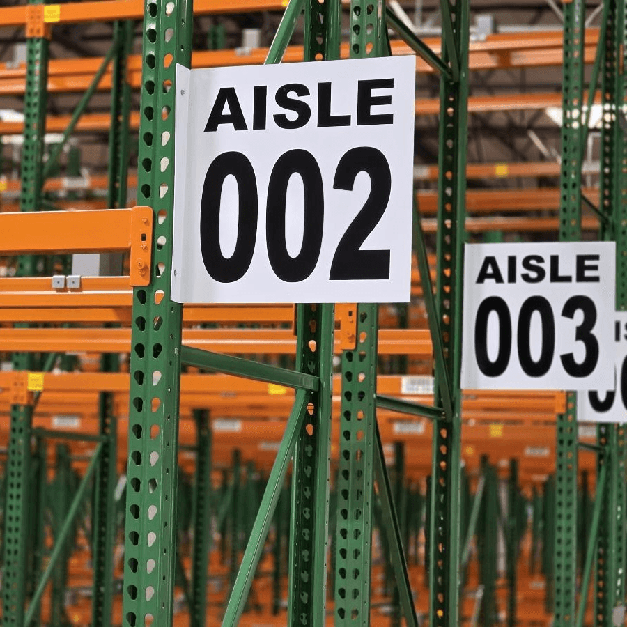Aisle 002 and 003 identification signs mounted on warehouse pallet racks