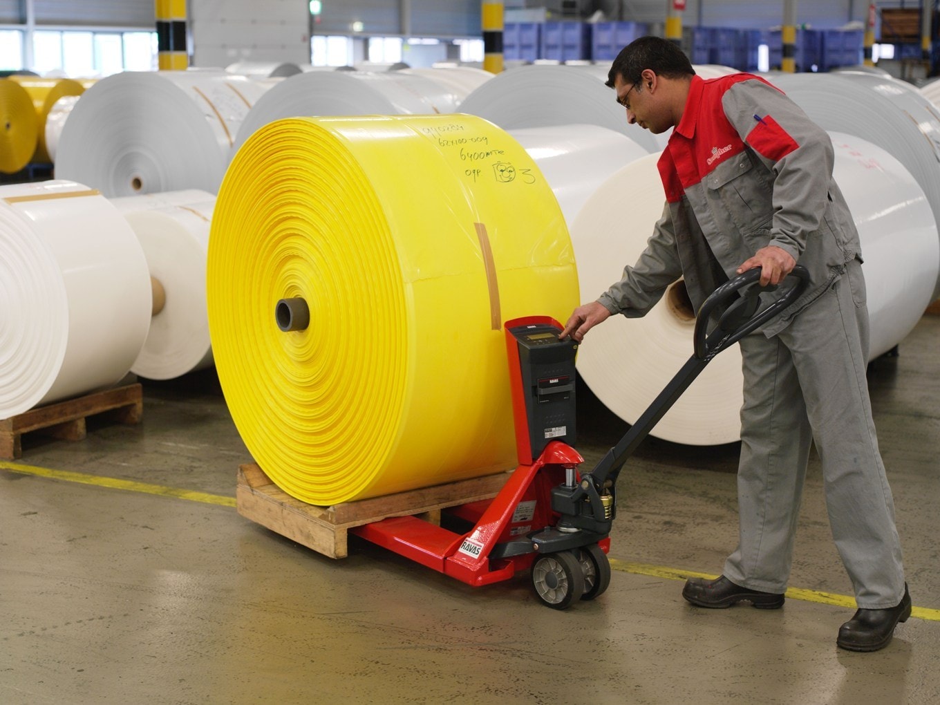 Pallet jack moving a palletized load